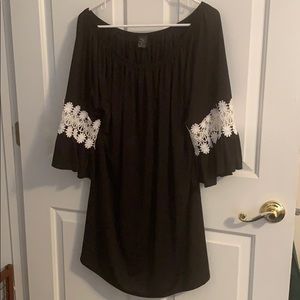Black swimsuit coverup with white lace sleeves